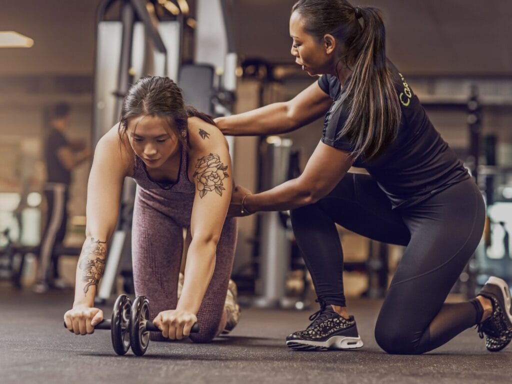 Vancouver personal trainer coaching a client at the gym