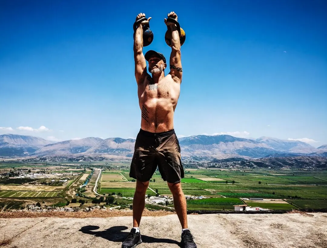 double kettlebell press outdoor functional training