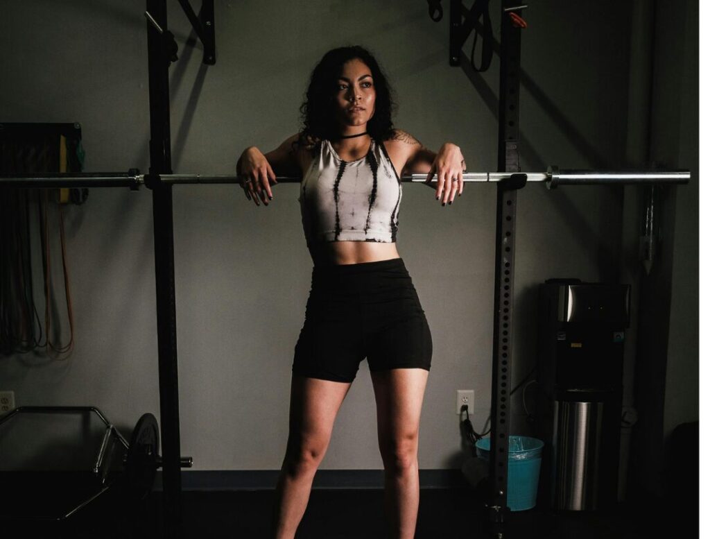woman barbell squat gym workout