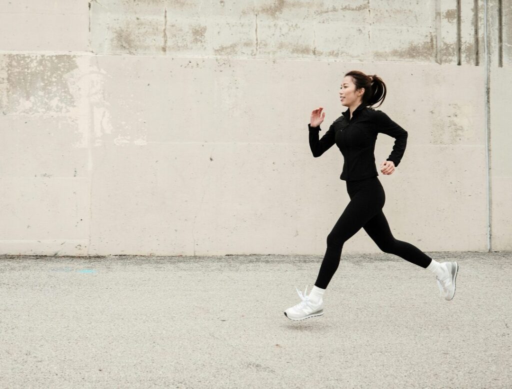 woman running outdoors cardio workout
